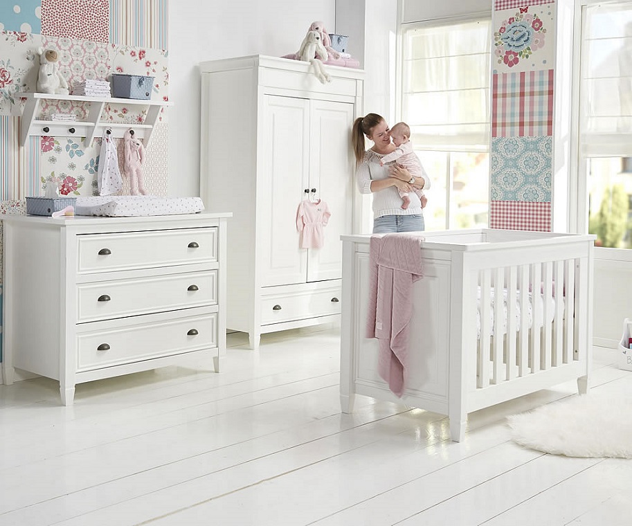 picture of a mother and a baby in a white nursery 