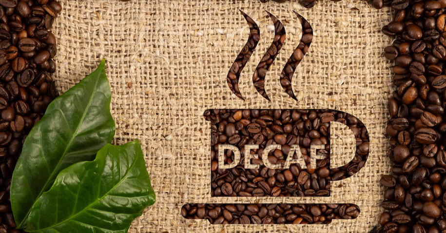 spelled decaf with coffee beans