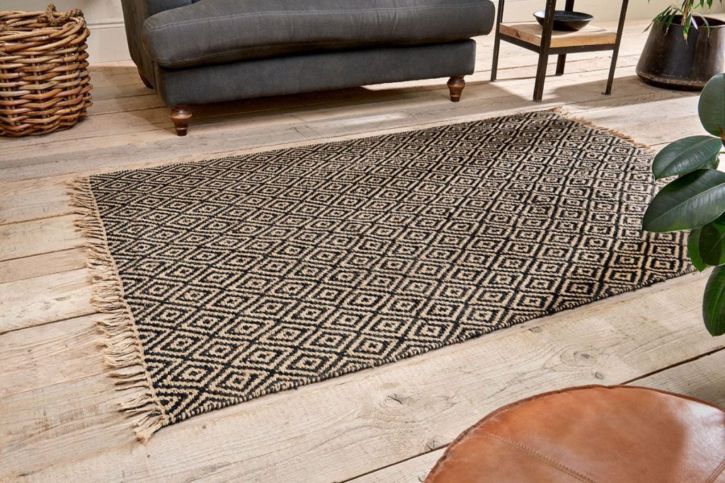 jute rug medium black in a living room